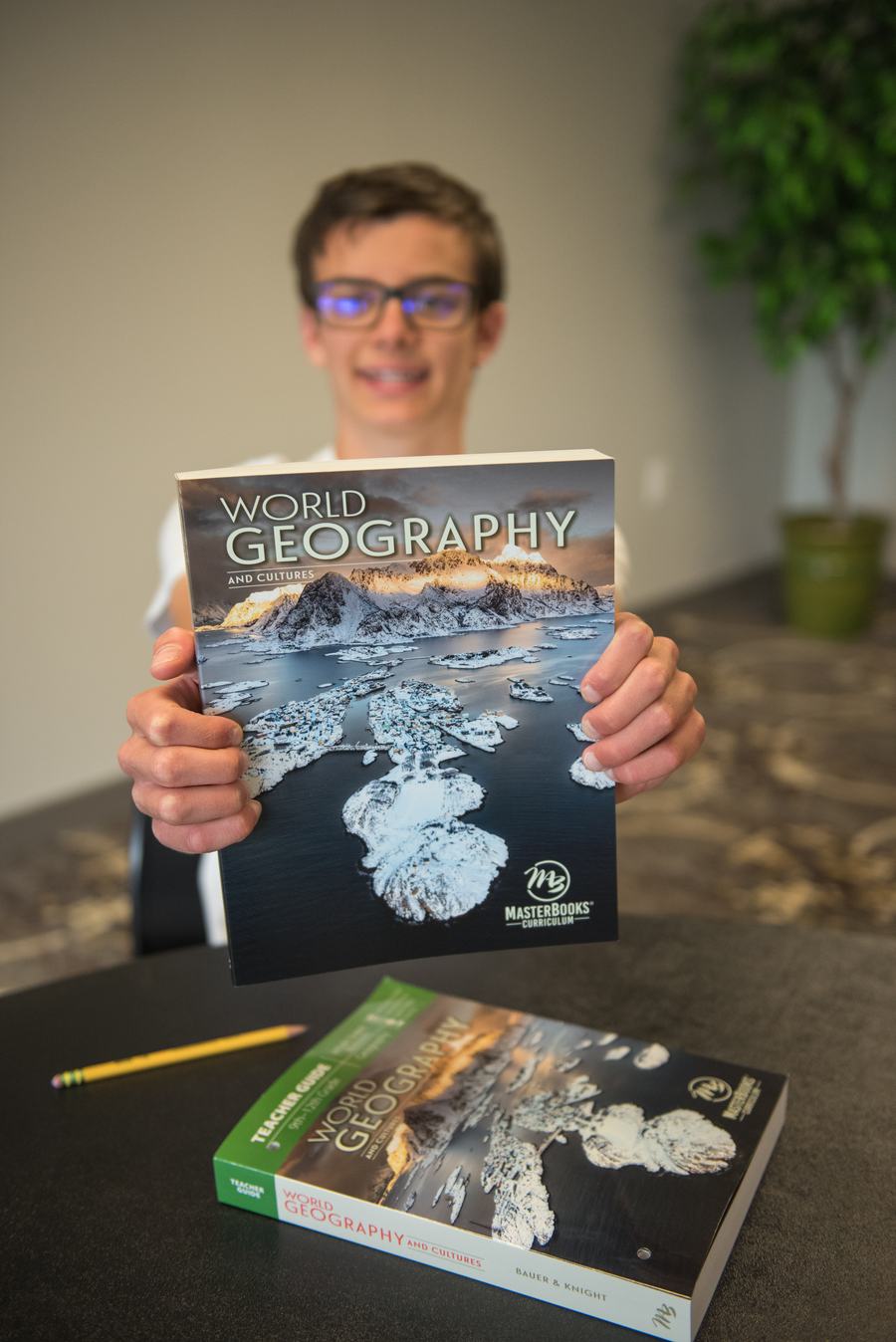 Teen smiling with World Geography