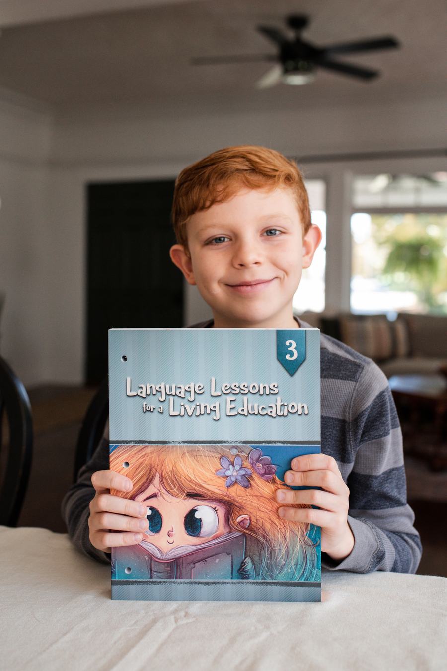 Boy smiling with Language Lessons for a Living Education 3